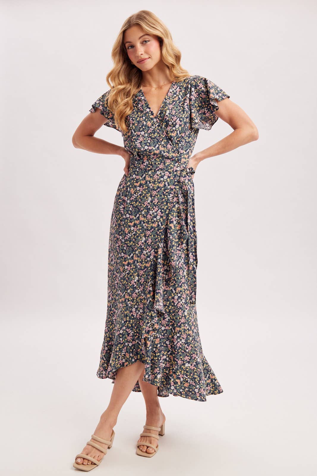 Woman wearing a floral dress on a white background