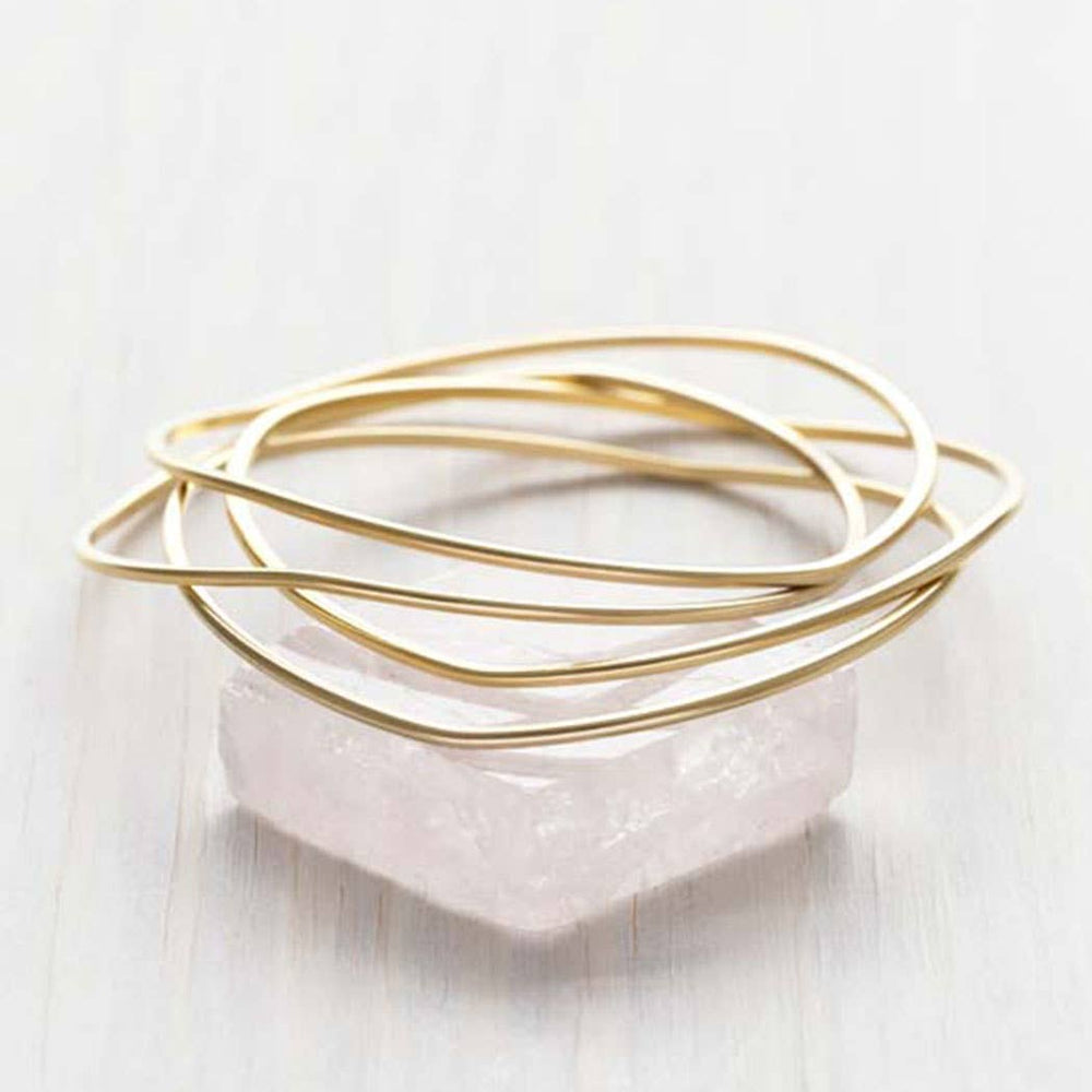 
                      
                        Gold Wave Bangle Set
                      
                    