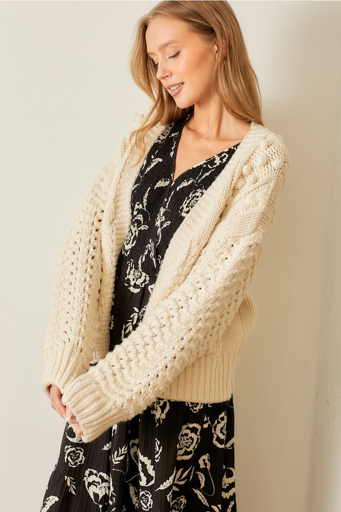 
                      
                        Pom Pom Cardigan
                      
                    