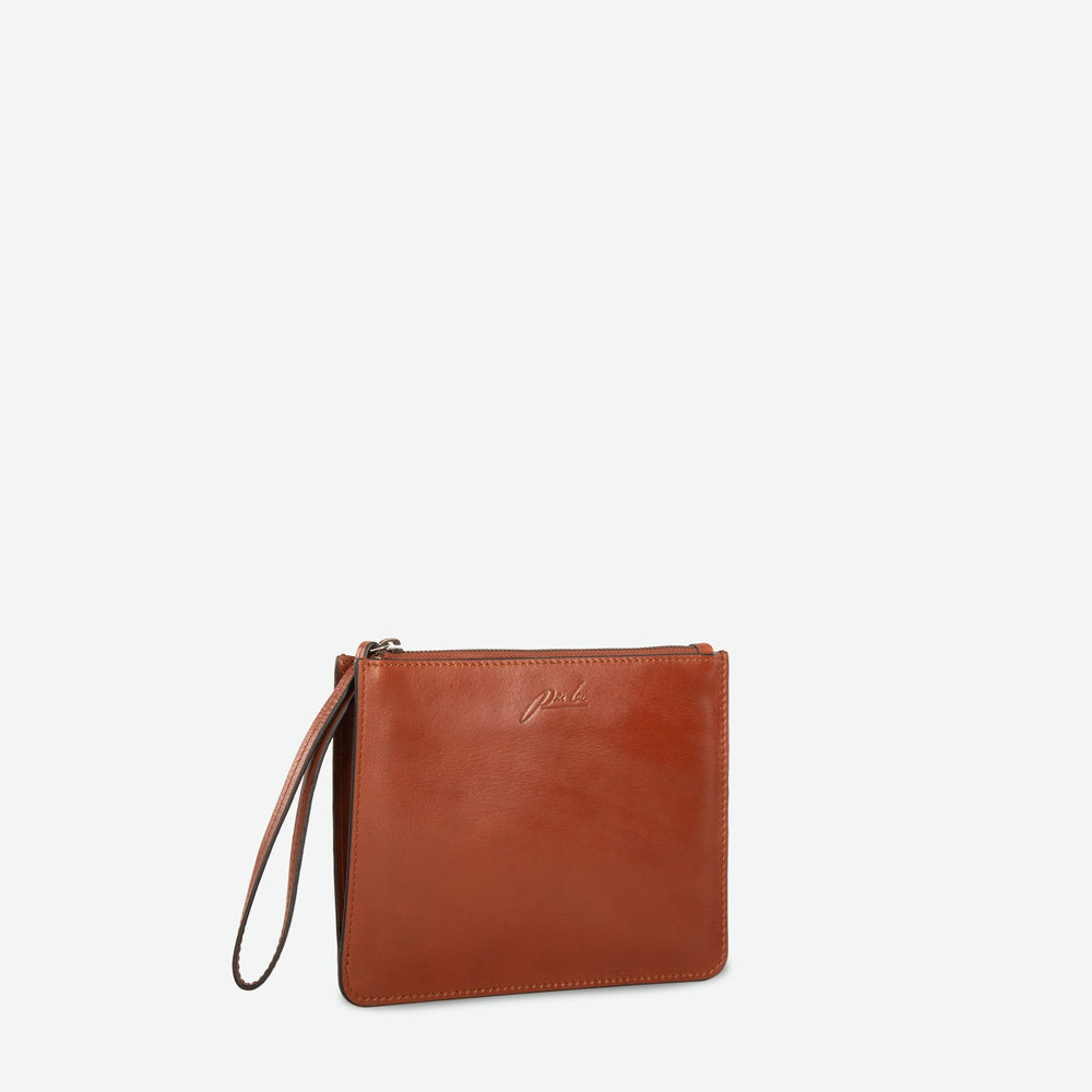 
                      
                        A chestnut brown rectangular  zip up pouch clutch with leather wristlet - image 2
                      
                    