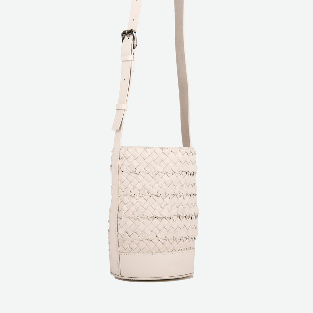 
                      
                        A mini small stone white woven leather bucket bag  with an adjustable crossbody strap - image 2
                      
                    