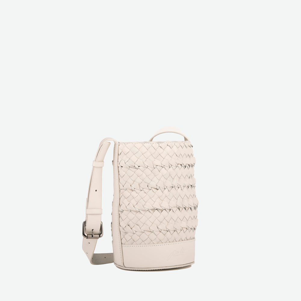 
                      
                        A mini small stone white woven leather bucket bag  with an adjustable crossbody strap - image 3
                      
                    